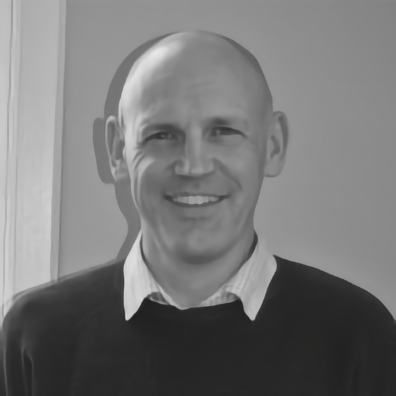 Barber 1 young man with beard smiling and wearing a  brown shirt