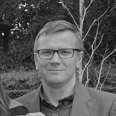 Barber 1 young man with beard smiling and wearing a  brown shirt